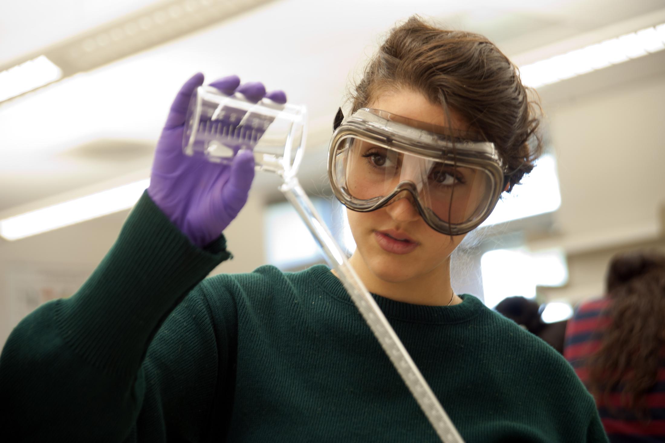 Angela Balestreri fills a graduated tube for her experiment