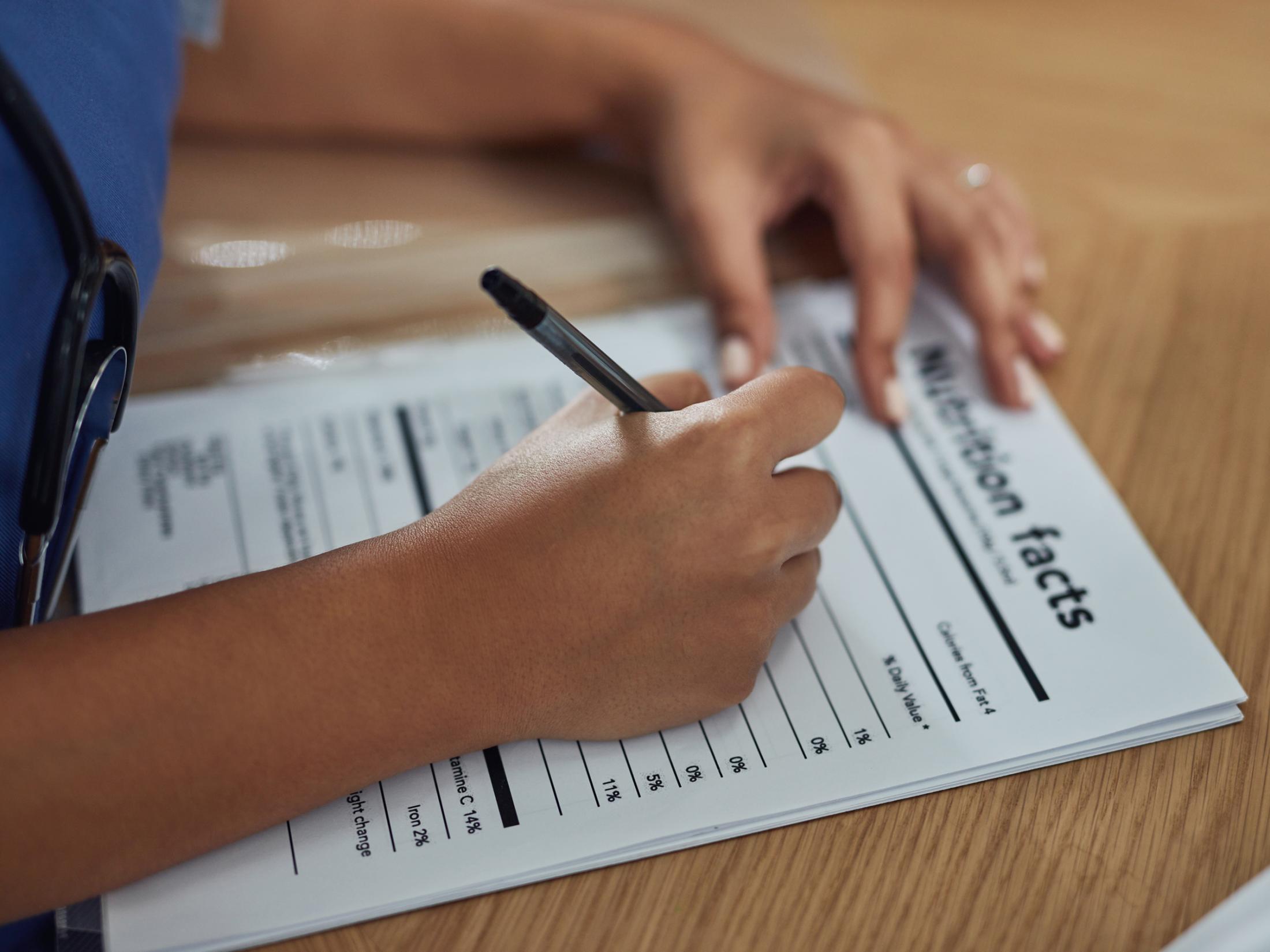 person filling out nutrition information